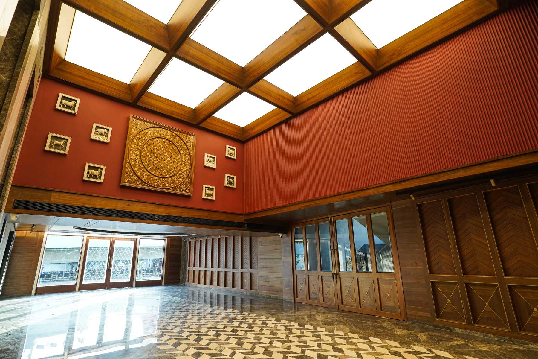 A striking photo of the Space Odyssey lobby with the illuminated skylight ceiling from NEWMAT as the focal point.
