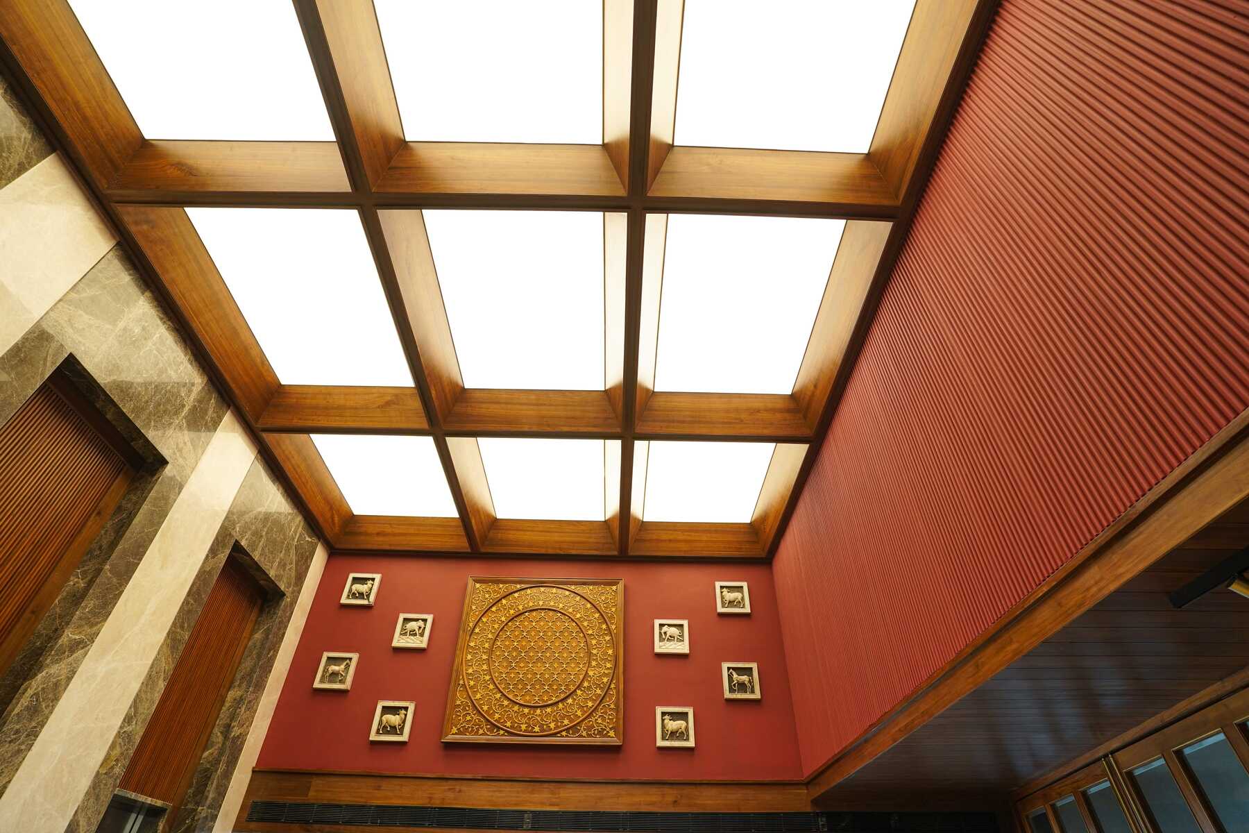 A striking photo of the Space Odyssey lobby with the illuminated skylight ceiling from NEWMAT as the focal point.