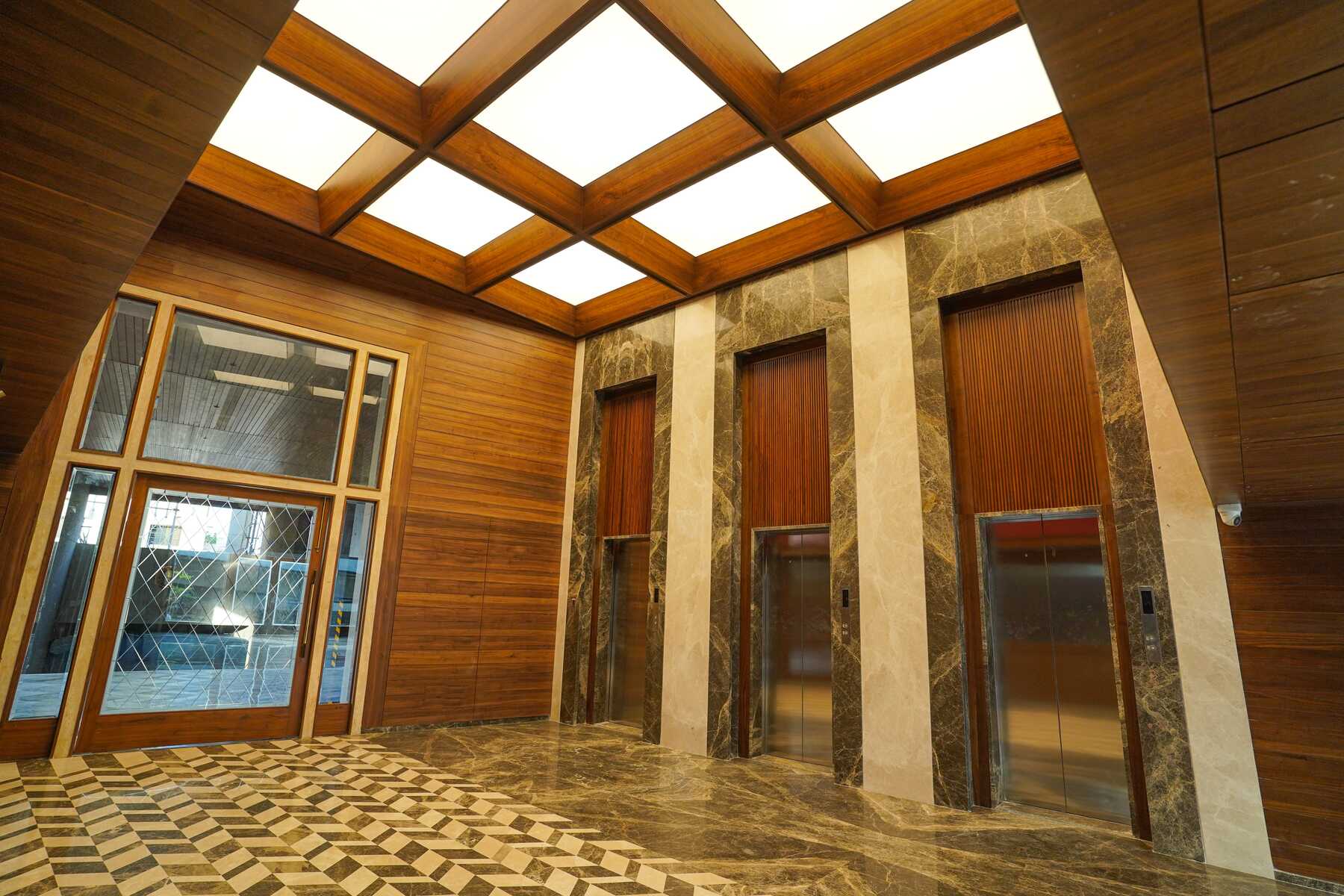 A striking photo of the Space Odyssey lobby with the illuminated skylight ceiling from NEWMAT as the focal point.