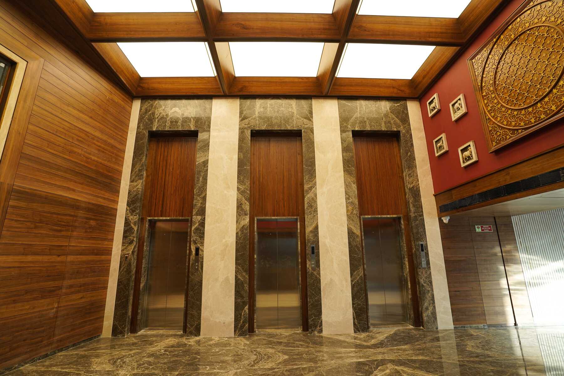 A striking photo of the Space Odyssey lobby with the illuminated skylight ceiling from NEWMAT as the focal point.